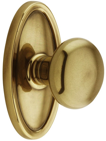 Oval Rosette Set With Providence Knobs in Antique Brass.